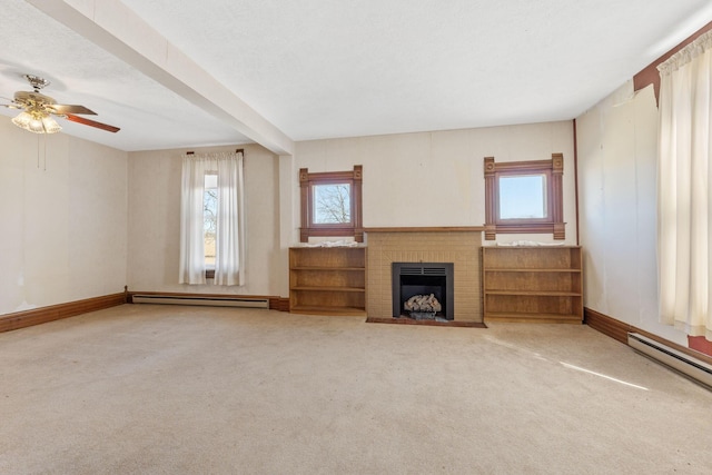 unfurnished living room with baseboards, a baseboard heating unit, carpet floors, and a brick fireplace