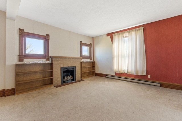 unfurnished living room with a fireplace, baseboards, carpet floors, and a baseboard radiator