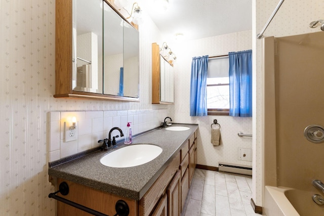 full bath with wallpapered walls, a baseboard radiator, and a sink