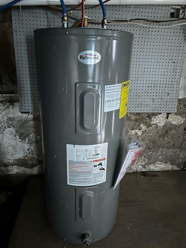 utility room featuring electric water heater