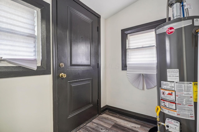 utility room featuring gas water heater