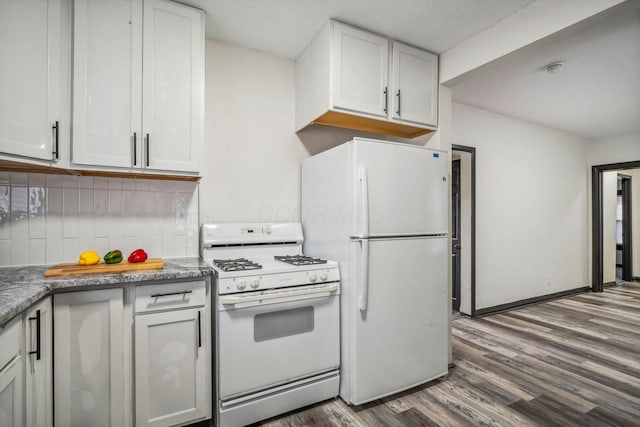 kitchen featuring white appliances, tasteful backsplash, dark wood-style flooring, and white cabinetry