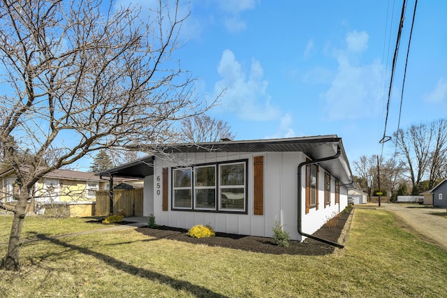 view of property exterior featuring a lawn and board and batten siding