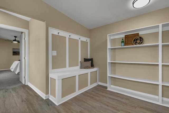 mudroom with wood finished floors, a ceiling fan, and baseboards