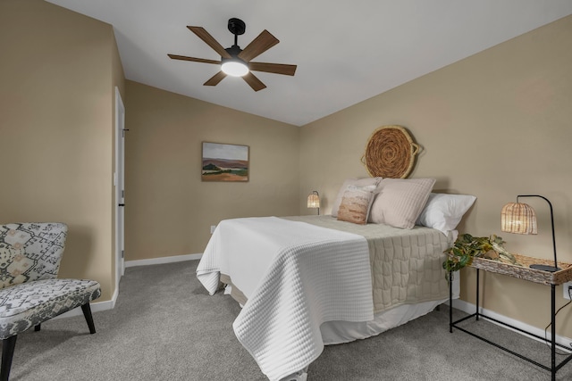 bedroom with vaulted ceiling, baseboards, carpet floors, and ceiling fan