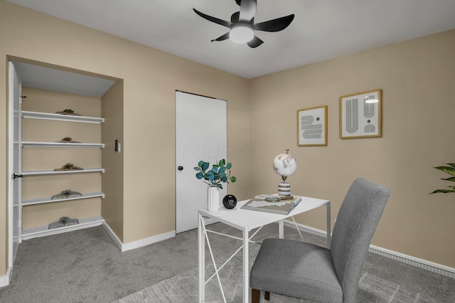 carpeted office featuring baseboards and ceiling fan