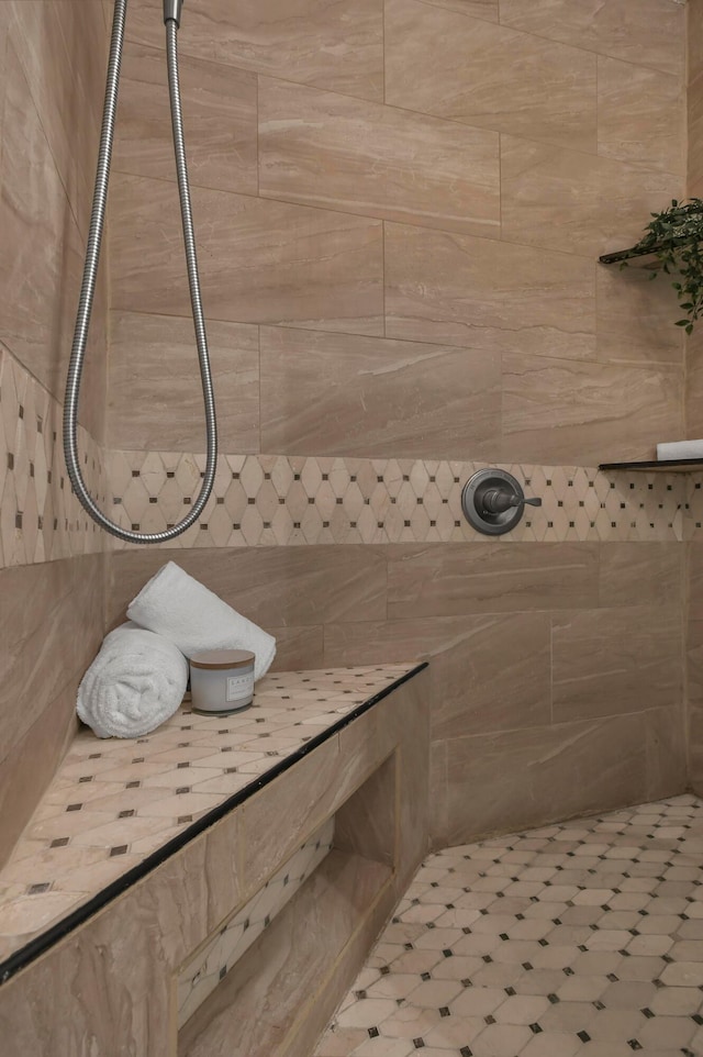 bathroom with tiled shower