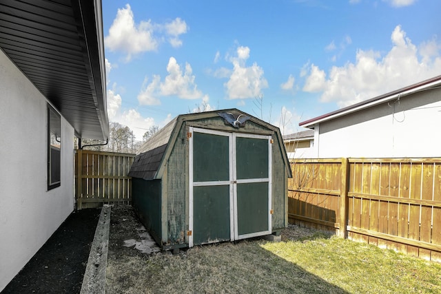 view of shed featuring a fenced backyard