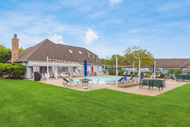 pool with a patio, a yard, and a pergola