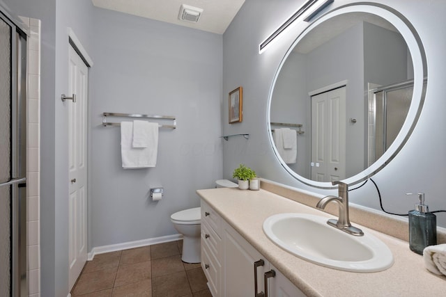 full bath with tile patterned floors, visible vents, toilet, a tile shower, and vanity