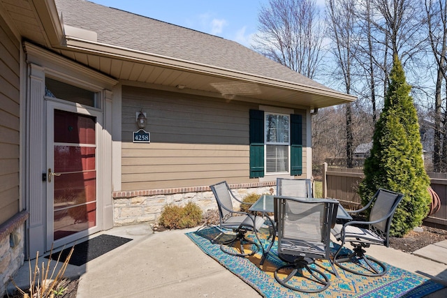 view of patio / terrace featuring outdoor dining area and fence