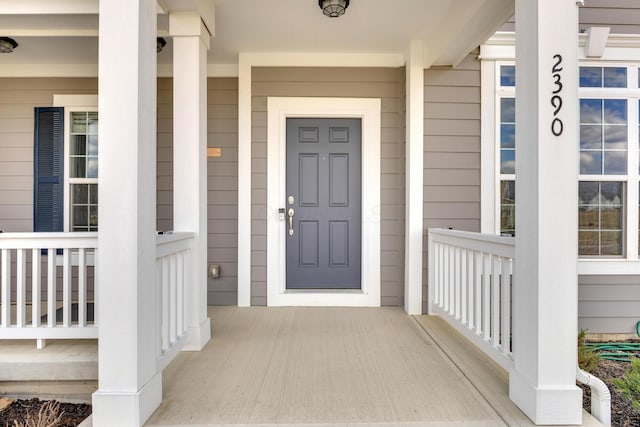 doorway to property with covered porch