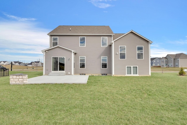 rear view of property with a lawn and a patio area