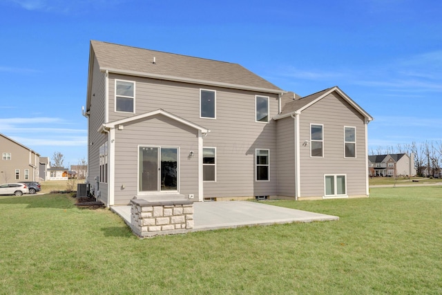 back of property featuring central air condition unit, a yard, and a patio area