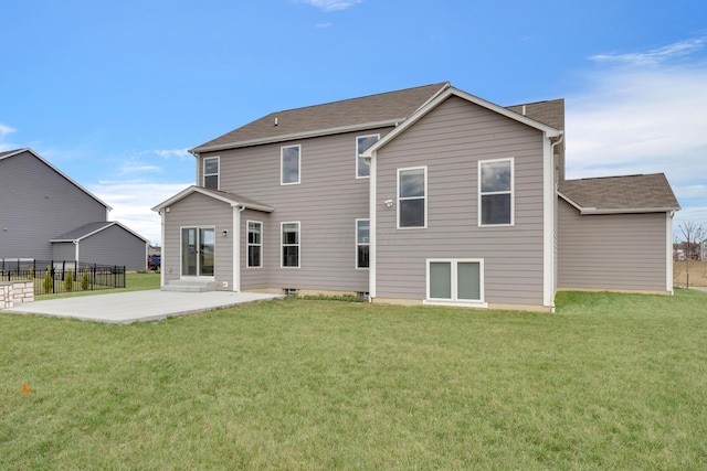 back of house with fence, a lawn, entry steps, and a patio area