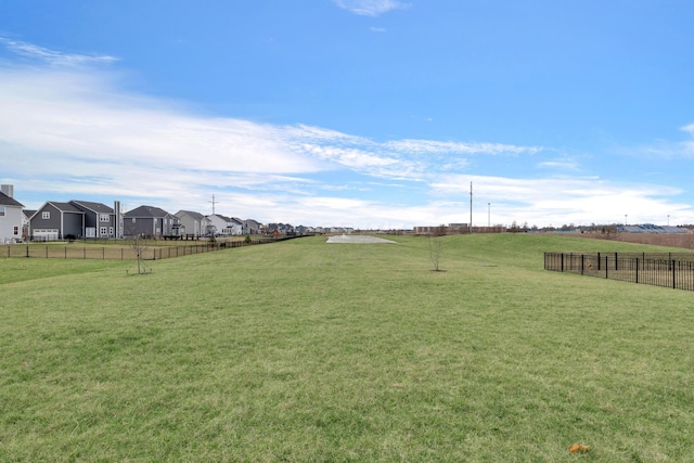 view of yard featuring a residential view and fence
