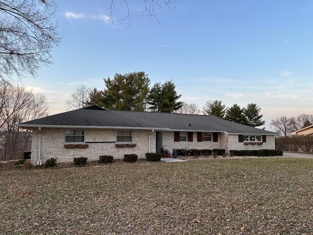 single story home with stone siding