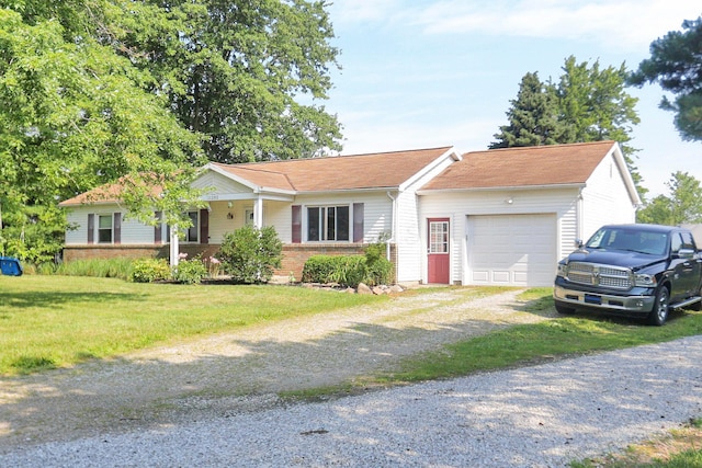 ranch-style home featuring brick siding, an attached garage, a front lawn, and dirt driveway