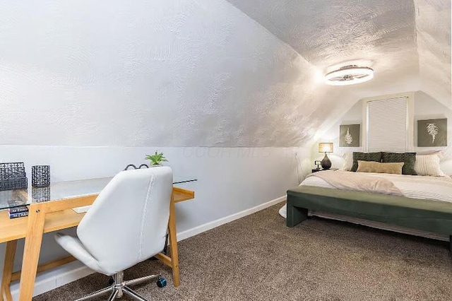 carpeted bedroom featuring baseboards, lofted ceiling, and a textured ceiling