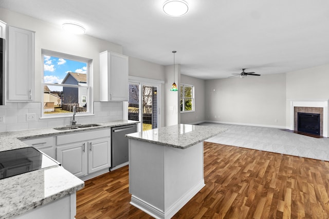 kitchen with a sink, white cabinetry, dishwasher, ceiling fan, and dark wood-style flooring