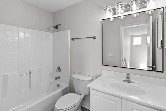 bathroom with toilet, shower / washtub combination, and vanity