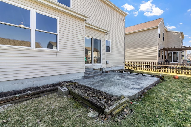 view of patio / terrace with entry steps, fence, and a pergola