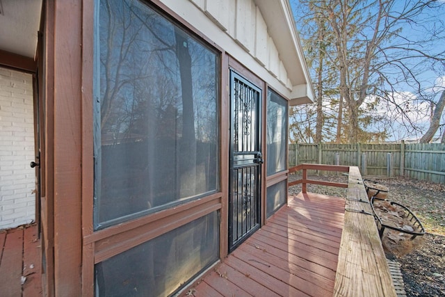 wooden deck featuring a fenced backyard