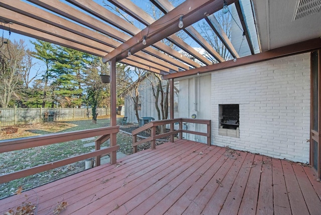 wooden terrace featuring a pergola and fence