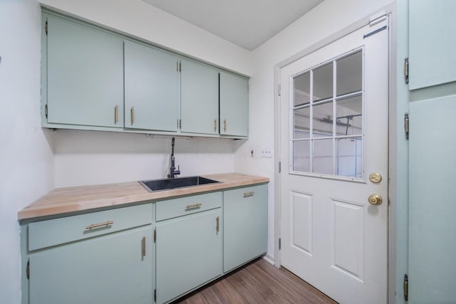 kitchen with dark wood-type flooring and a sink