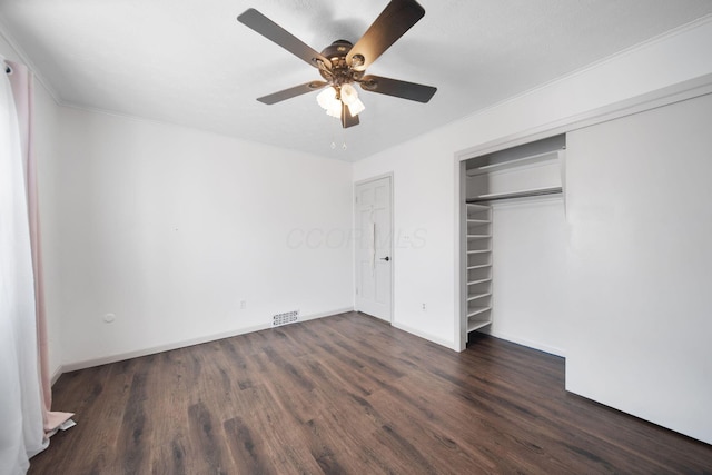 unfurnished bedroom with ceiling fan, visible vents, a closet, and wood finished floors