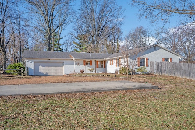 single story home with an attached garage, driveway, a front lawn, and fence