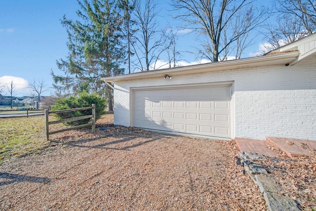 garage with fence