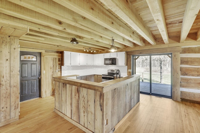 kitchen featuring beam ceiling, white cabinets, electric stove, light wood-style floors, and black microwave