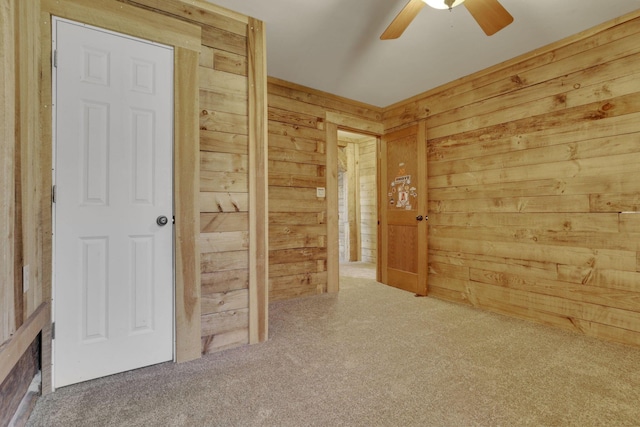 interior space with wooden walls and carpet flooring