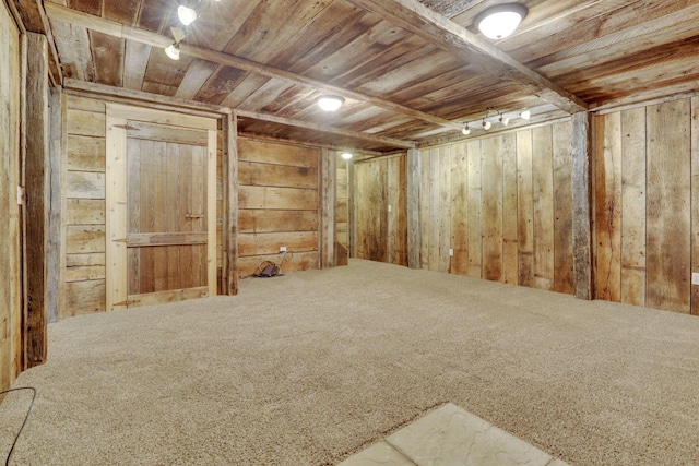 unfurnished room featuring wood walls and wooden ceiling