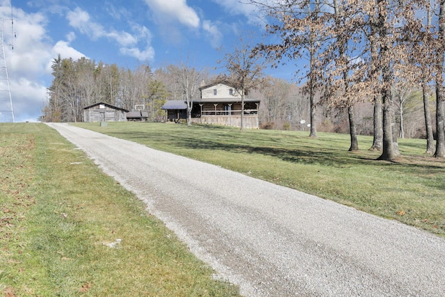 view of road featuring aphalt driveway