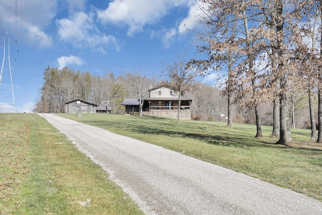 view of road featuring aphalt driveway