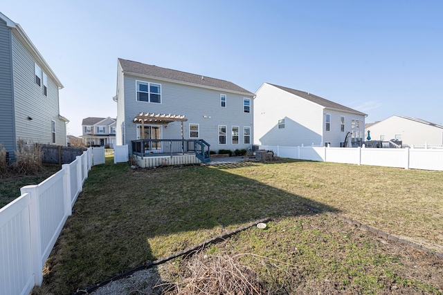 rear view of property with a fenced backyard, a pergola, and a yard