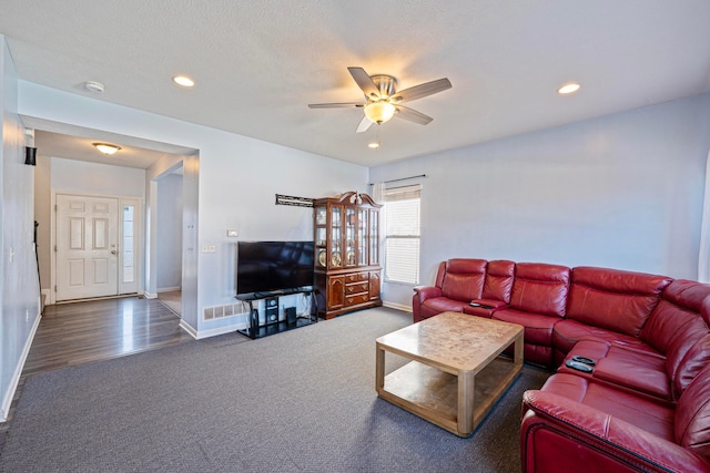 carpeted living room featuring recessed lighting, a ceiling fan, and baseboards