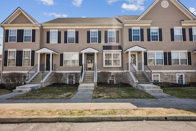 townhome / multi-family property featuring central AC unit