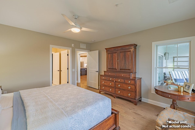 bedroom with light wood-style flooring, visible vents, baseboards, and ceiling fan