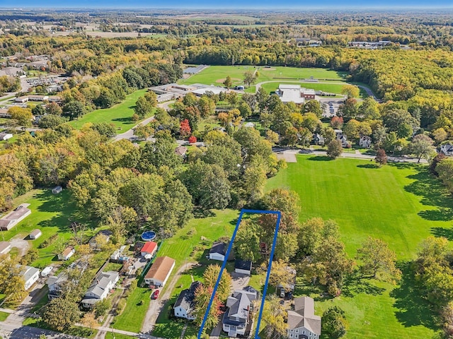 bird's eye view featuring a wooded view