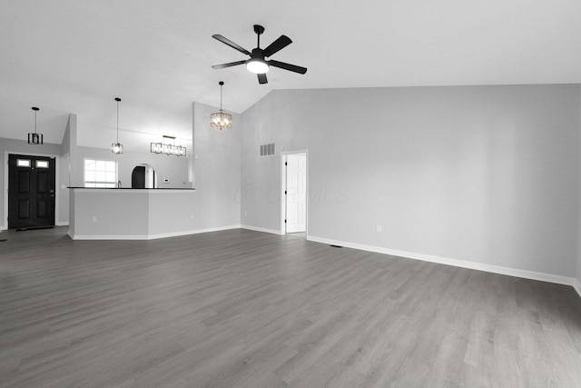 unfurnished living room featuring baseboards, visible vents, high vaulted ceiling, dark wood-style flooring, and ceiling fan with notable chandelier