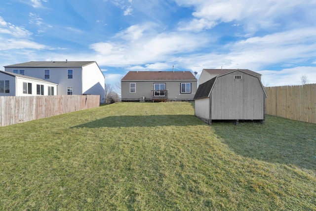 exterior space with an outdoor structure, a storage unit, and a fenced backyard