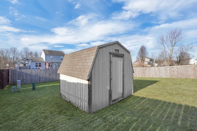 view of shed featuring a fenced backyard