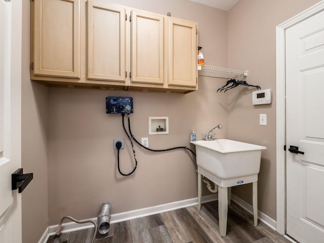 laundry area featuring baseboards, cabinet space, dark wood-style floors, and hookup for a washing machine