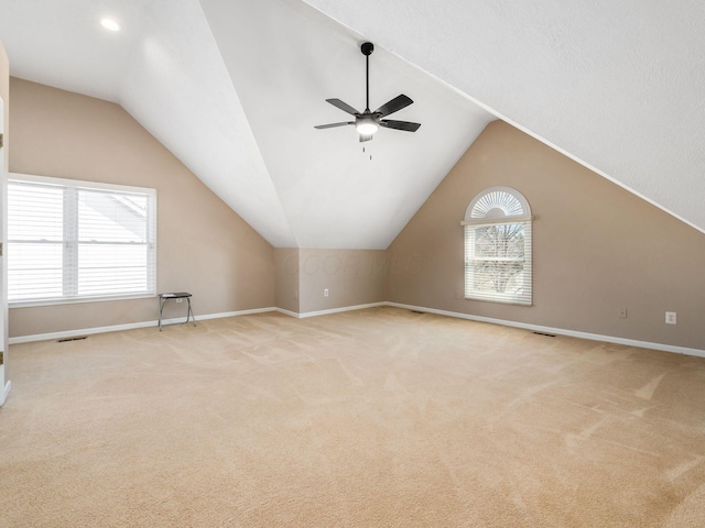 additional living space with visible vents, carpet, baseboards, and ceiling fan