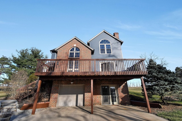 chalet / cabin with driveway, a chimney, stairs, a garage, and brick siding