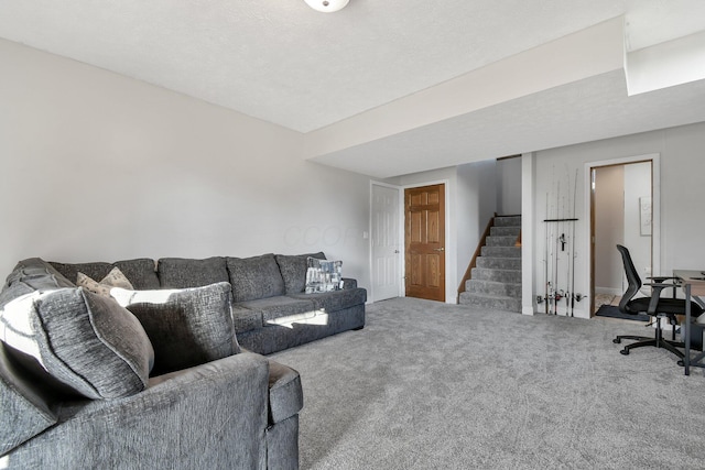 carpeted living area with stairs