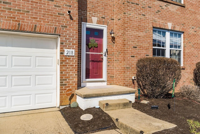 entrance to property featuring brick siding